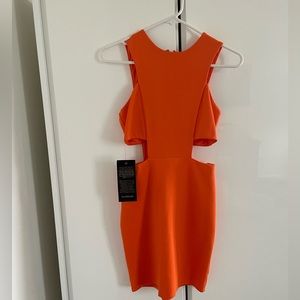 bebe orange mini dress with open sides